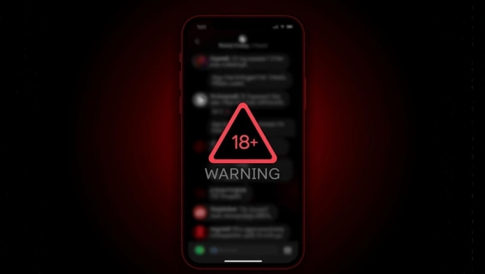 Smartphone screen with an 18+ warning symbol, illustrating OpenAI’s delayed adult mode for ChatGPT